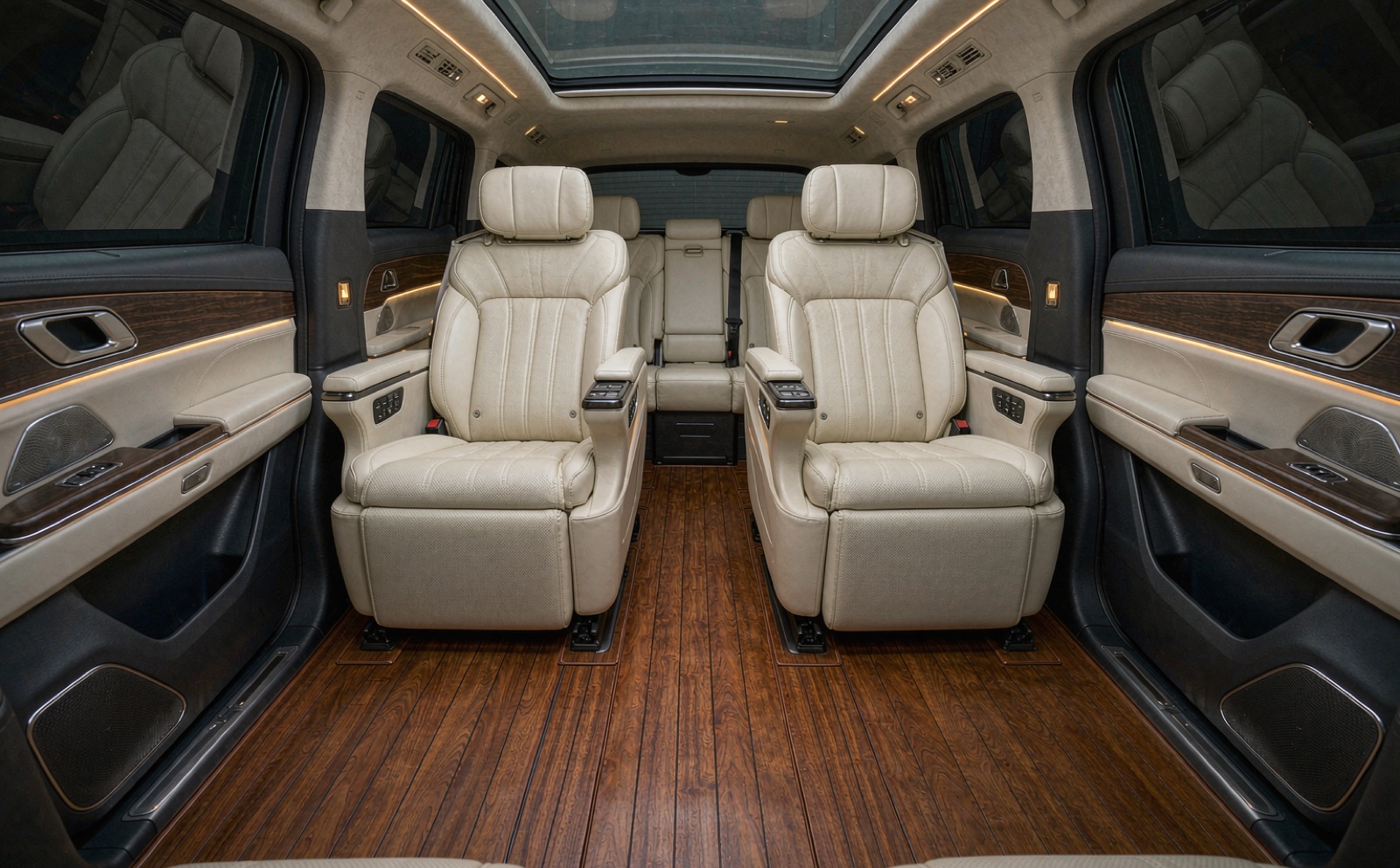 Rear cabin with a full wood floor kit covering the second and third rows